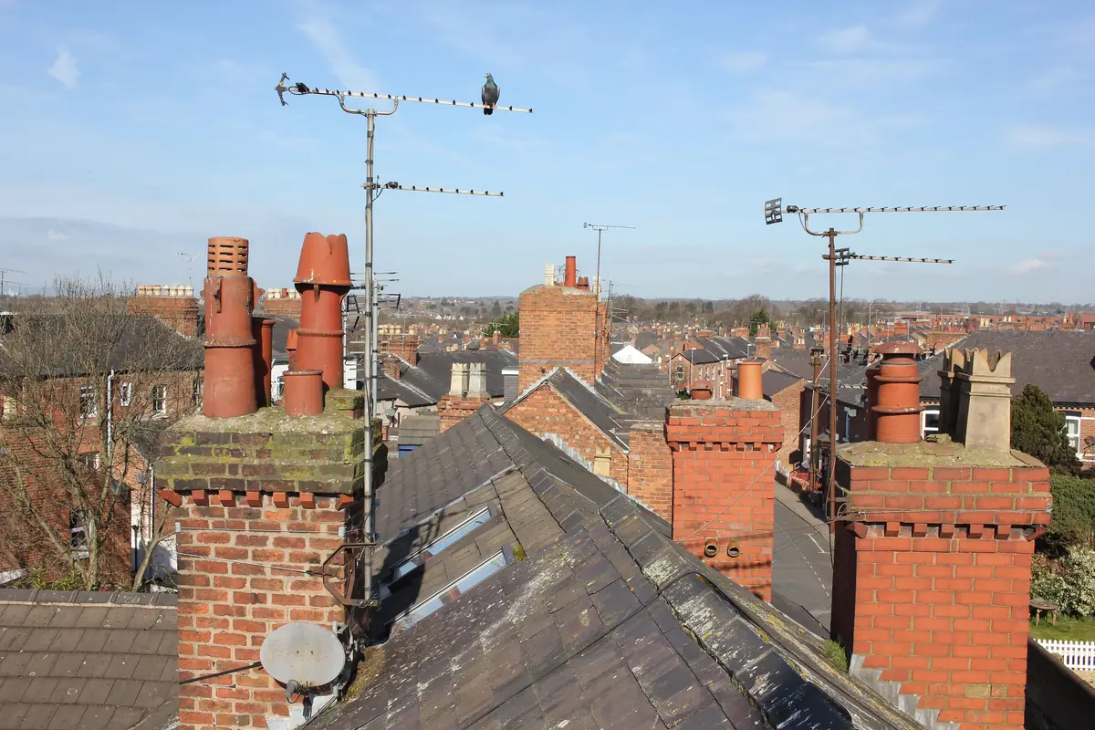 Terraced house rooftops and chimney pots in Chester